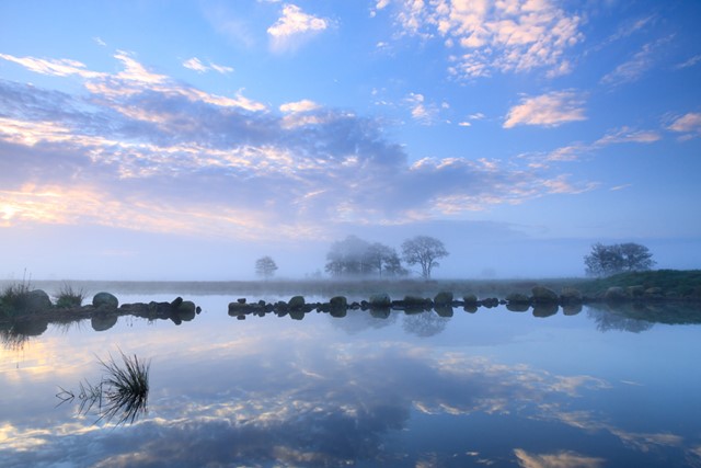 Slenk in de Onlanden tijdens zonsopkomst