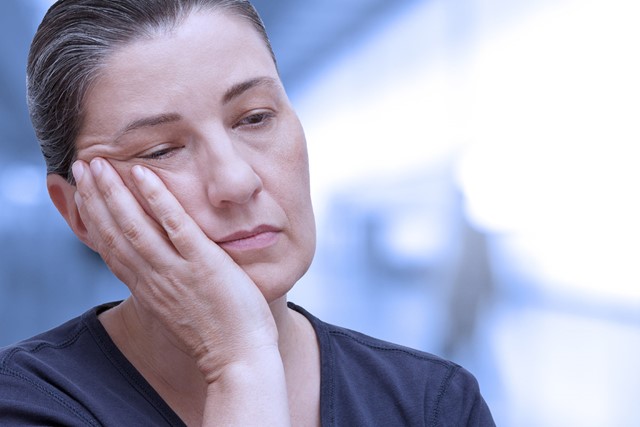 afbeelding van een vermoeide vrouw.